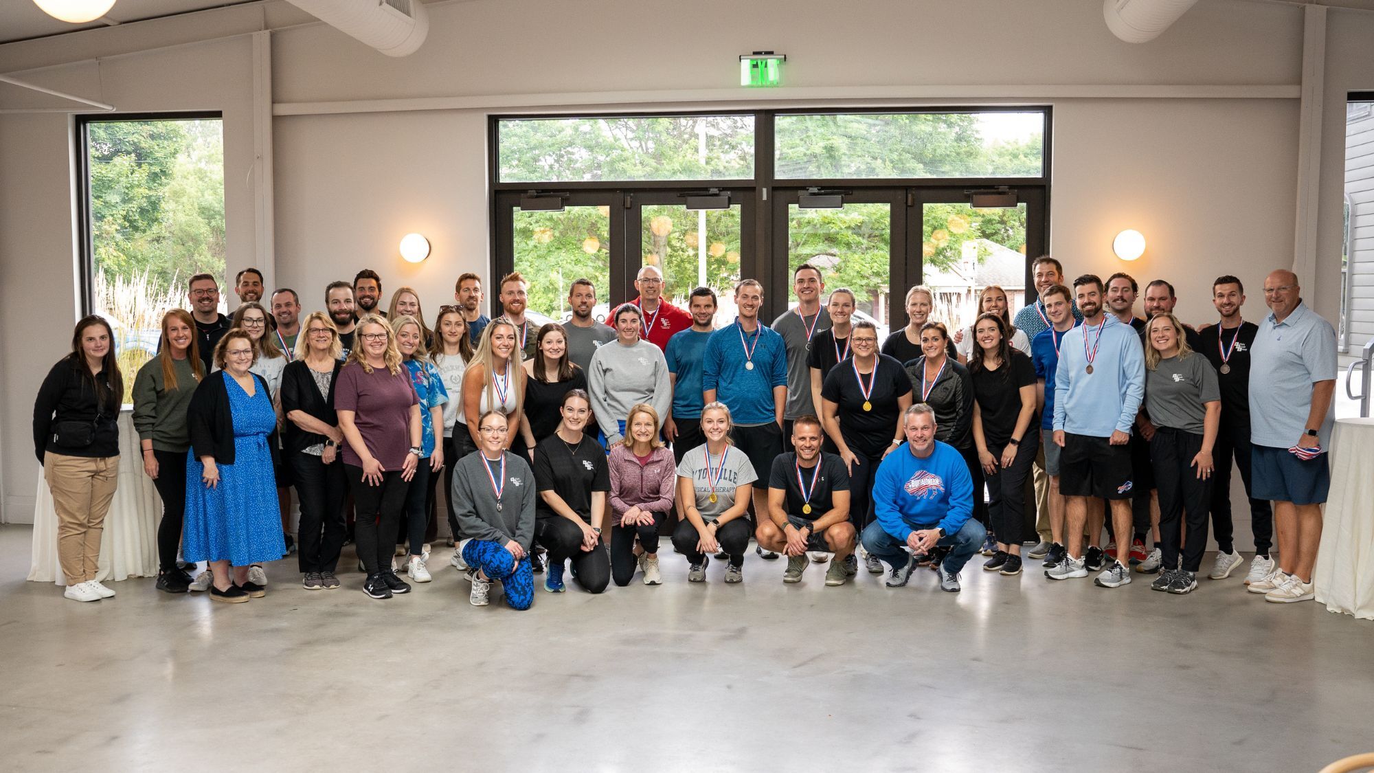 A large group of employees smiling for the camera