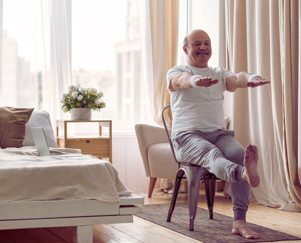 An Occupational Therapy Assistant smiles as she treats her patient.