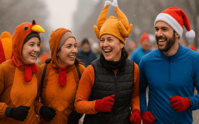 Four runners dressed in festive Thanksgiving costumes laughing together on a snowy Buffalo morning before the Turkey Trot.